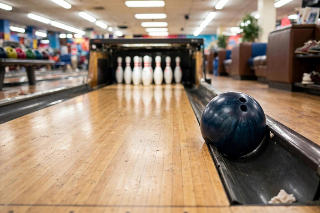 Bowling ball stuck in the gutter with pins standing far away, a classic gutter joke team moment